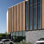 Exterior view of the St. Louis County Precinct 2 side, showcasing the copper panels and curtain wall