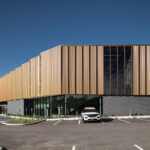 Exterior view of the St. Louis County Precinct 2 back, showcasing the copper panels and curtain wall