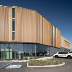 Exterior view of the St. Louis County Precinct 2 back, showcasing the copper panels and curtain wall