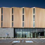 Exterior view of the St. Louis County Precinct 2 back, showcasing the copper panels and curtain wall