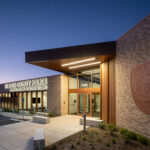Exterior view of the St. Louis County Precinct 2 building entrance at dusk